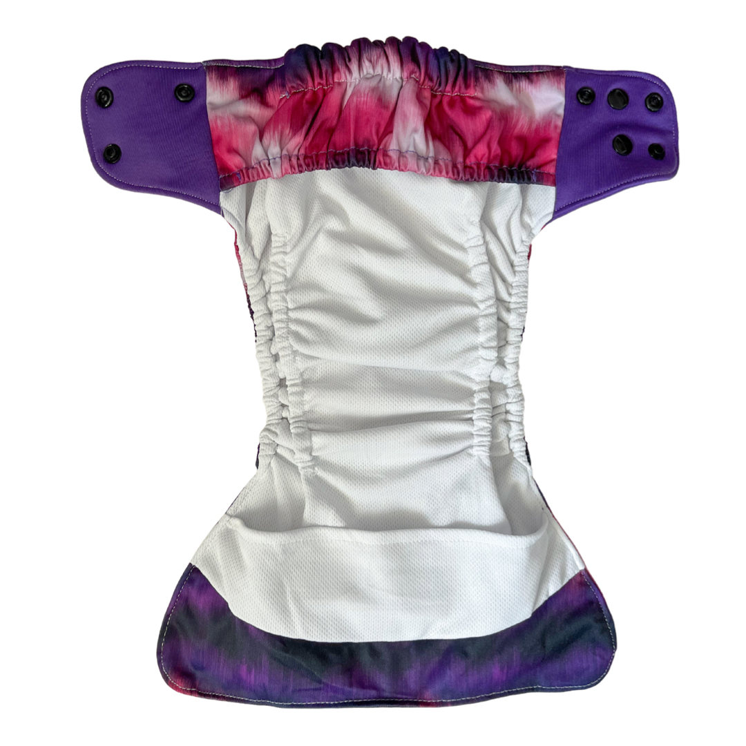 Photo: River & Bee modern cloth nappy with stay dry lining, internal double gussets and front and back leak guards. Flatlay of the inside of the nappy.